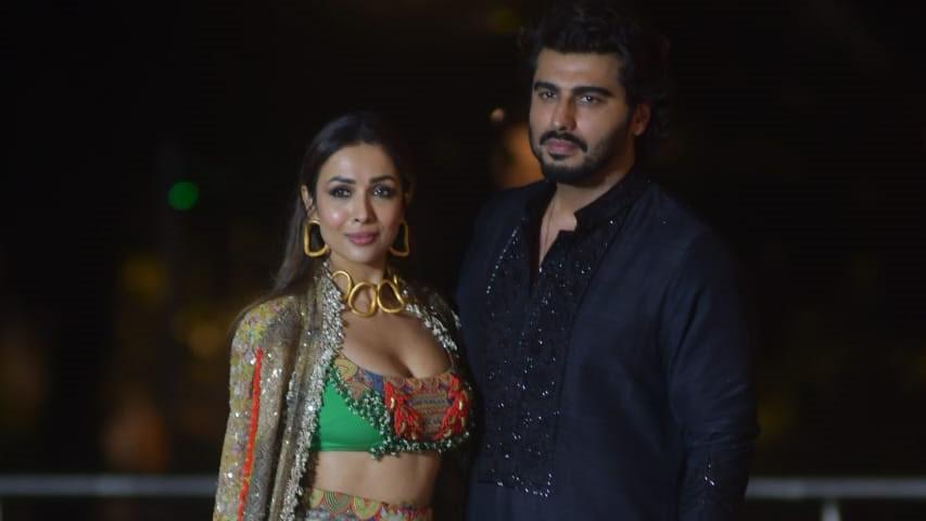 Malaika stole the show in her Indo-western outfit. Arjun looked handsome in a black kurta.