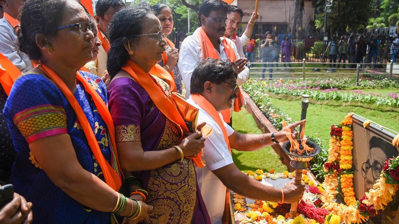 Uddhav-led Sena faction workers carry flaming torch during visit to Bal Thackeray's memorial in Mumbai