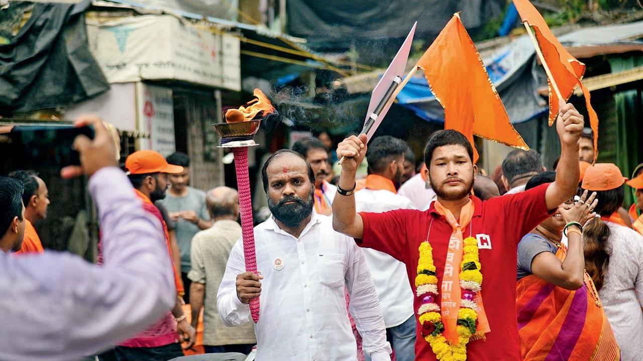 Supporters from the Maha Vikas Aghadi (MVA) alliance join Latke’s campaign trail, wielding the mashaal, which is the new Shiv Sena symbol of Uddhav Thackeray’s faction 
