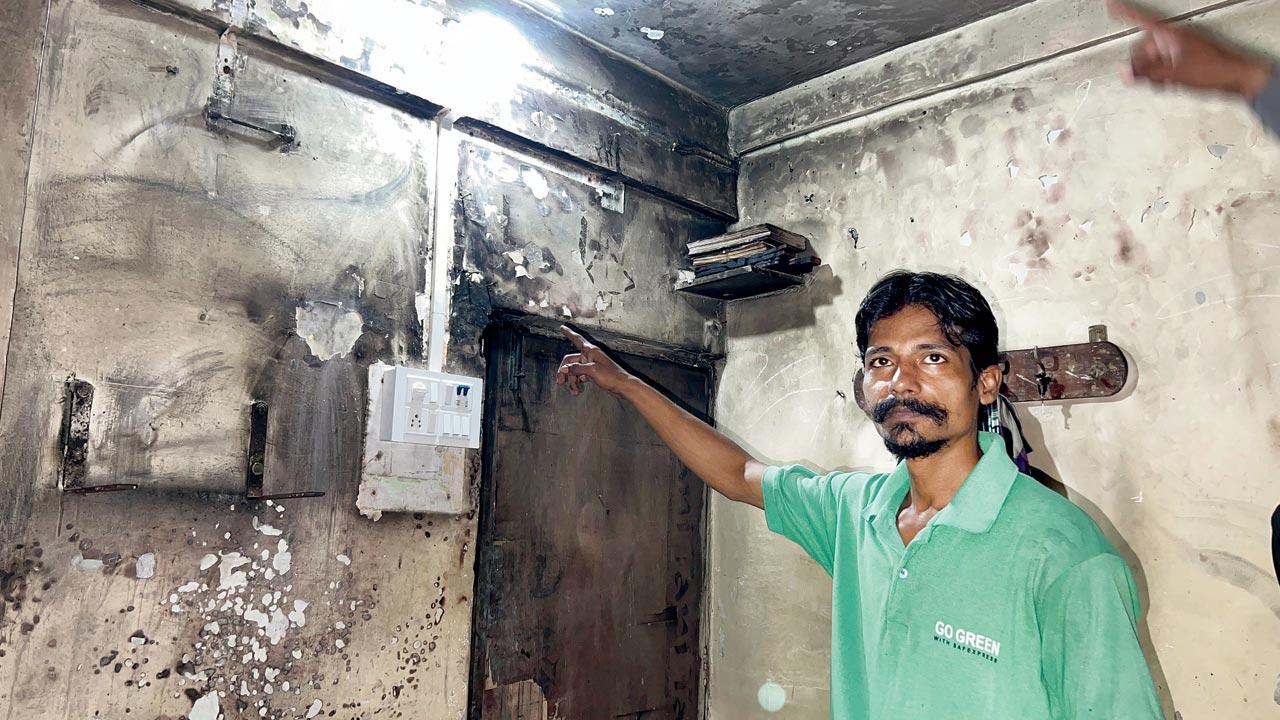 Windowpanes that were shattered due to the blast, money that was lying around in the living room, which was damaged in the blast  Shahnawaz Ansari shows the extent of damage done to his home. 