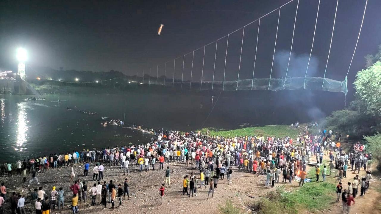 IN PHOTOS: Several dead as century-old cable bridge collapses in Gujarat
