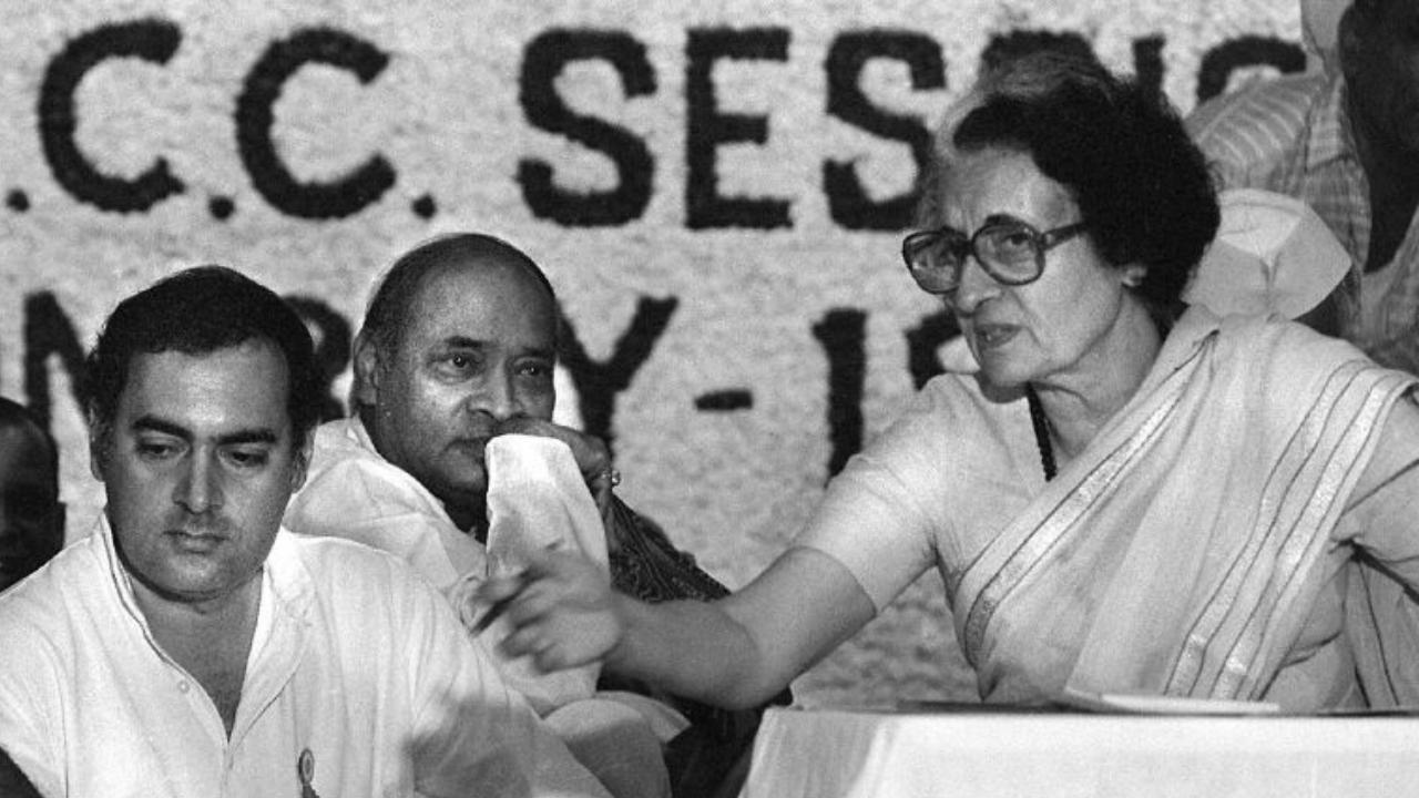 In this picture taken early 1984 shows Indian prime minister Indira Gandhi (R) and her son Rajiv (L) at a Congress Party meeting in New Delhi