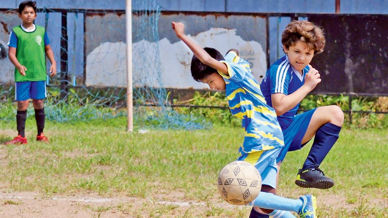 Dhirubhai Ambani and St Joseph’s fight it out during the boys U-12 tie at Azad Maidan yesterday. Pic/Ashish Raje