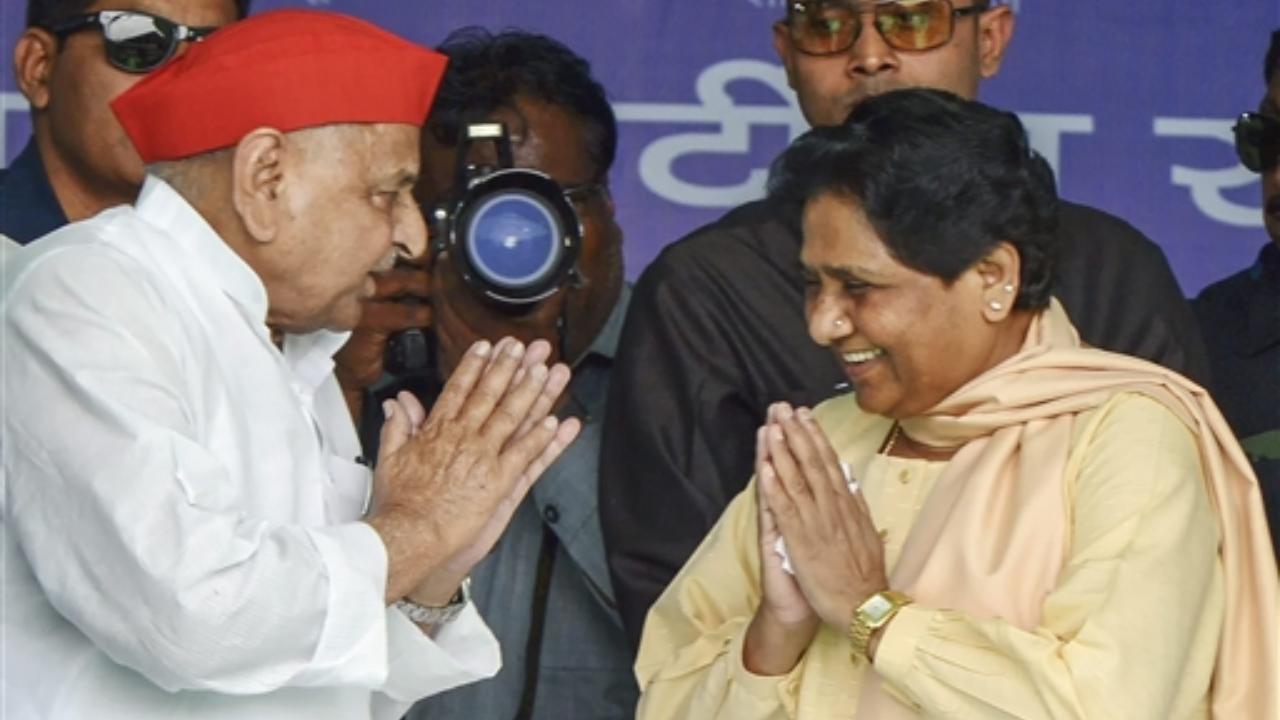 April 19, 2019: Samajwadi Party patron Mulayam Singh Yadav exchanges greetings with Bahujan Samaj Party supremo Mayawati during their joint election campaign rally in Mainpuri. File Pic/PTI