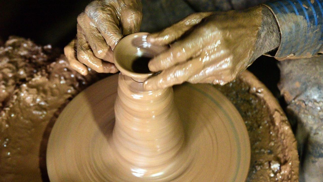 A potter can be seen making a Diwali lamp (diya) on the power wheel in Kumbharwada Pic/Pradeep Dhivar