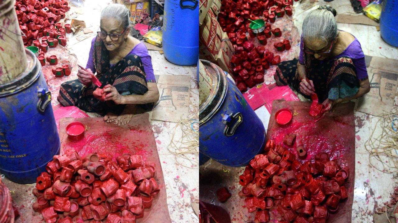 An old lady paints diyas in Kumbharwada for her living Pic/Pradeep Dhivar