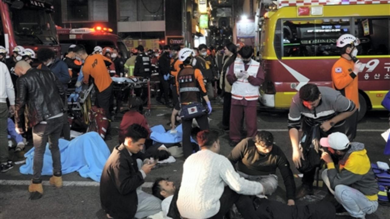 Rescue workers try to help injured people near the scene in Seoul, South Korea Pic/PTI