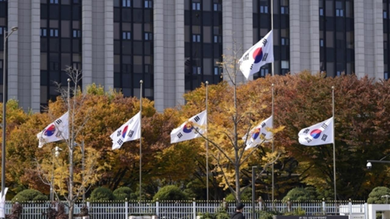 South Korean national flags fly at half-mast at the government complex in Seoul, South Korea Pic/PTI