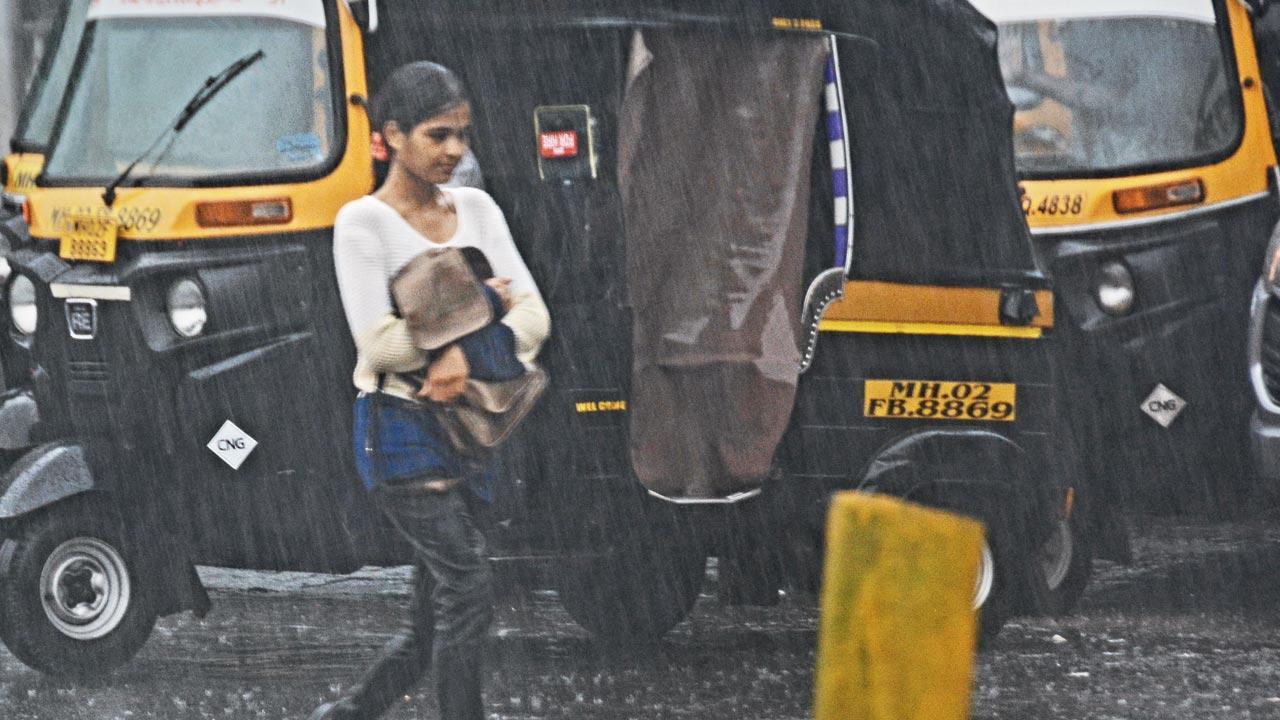 Mumbai: Rain floods parts of city, slows trains