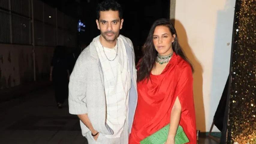 While wife Neha Dhupia dressed up in a red gown with an elaborate neckpiece, Angad Bedi kept it cool and casual. 