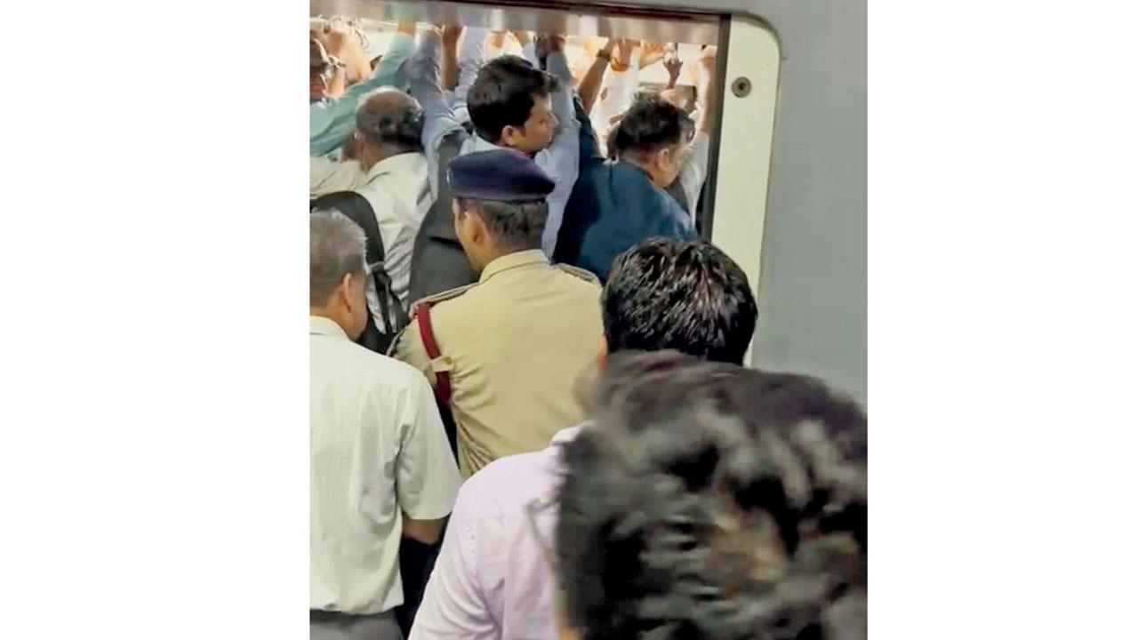 RPF personnel deployed at stations either push passengers inside or pull them out so that the doors of AC locals can close