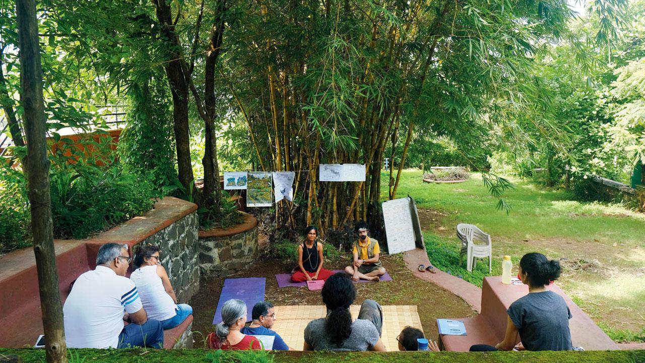 Participants engage in a discussion on sustainable permaculture techniques 