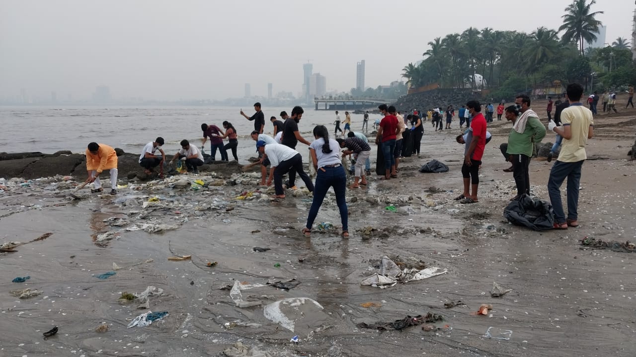Volunteers of NGO and Mumbaikars take part in beach clean-up drive at Dadar chowpatty after immersion of Lord Ganesha idols during Anant Chaturdashi.