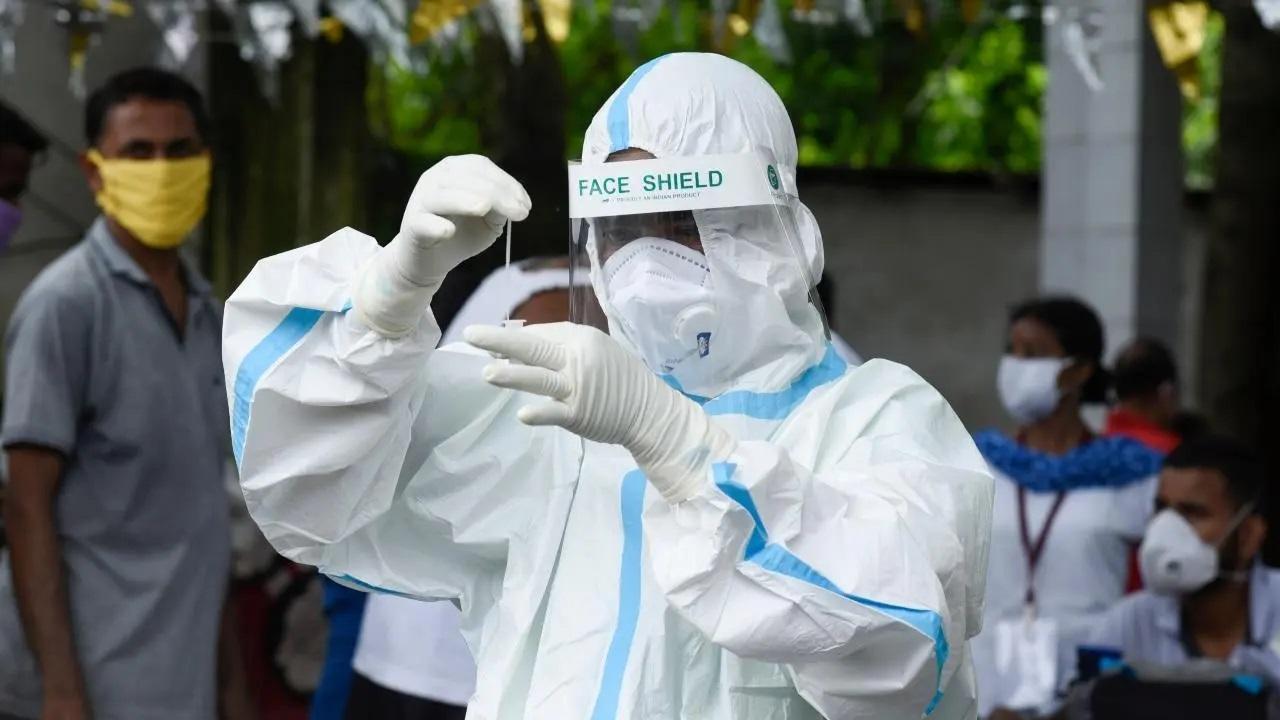 A health worker collects a swab sample for Covid-19 test. File Pic