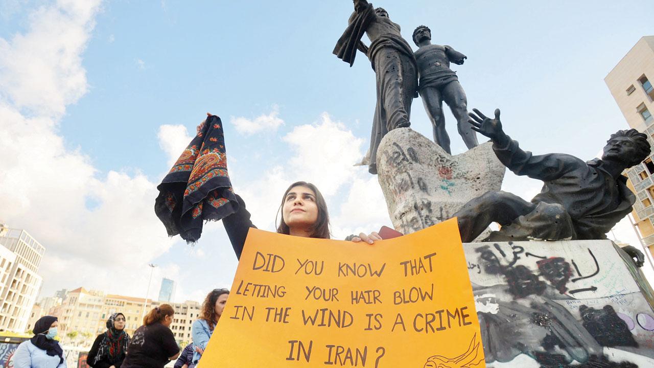 Kurdish and Lebanese women take part in a rally in Beirut to protest the death of Amini Wednesday. Pics/AFP