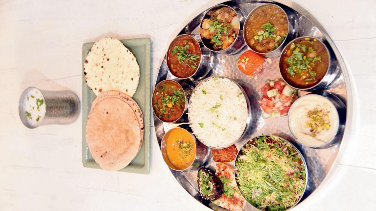 Akshay patra unlimited thali features four sabzis, dal and rice, two snacks, two phulkas and two dessert options