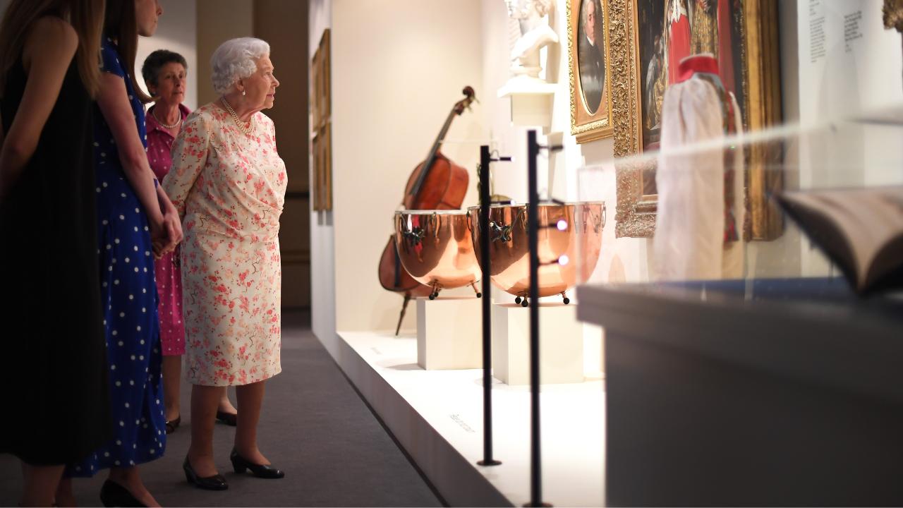 Whether it was the Queen’s birthday or coronation jubilees, the celebrations at the palace were marked by concerts and performances by finest musicians of the era. According to Discover Music, Queen Elizabeth II greatly enjoyed and championed classical music during her lifetime. In picture: Britain's Queen Elizabeth II looking at a painting of Luigi Lablache, Queen Victoria's singing teacher and some instruments used by Queen Victoria's private orchestra, as part of an exhibition to mark the 200th anniversary of the birth of Queen Victoria in London on July 17, 2019. (Photo by / AFP / Victoria Jones)