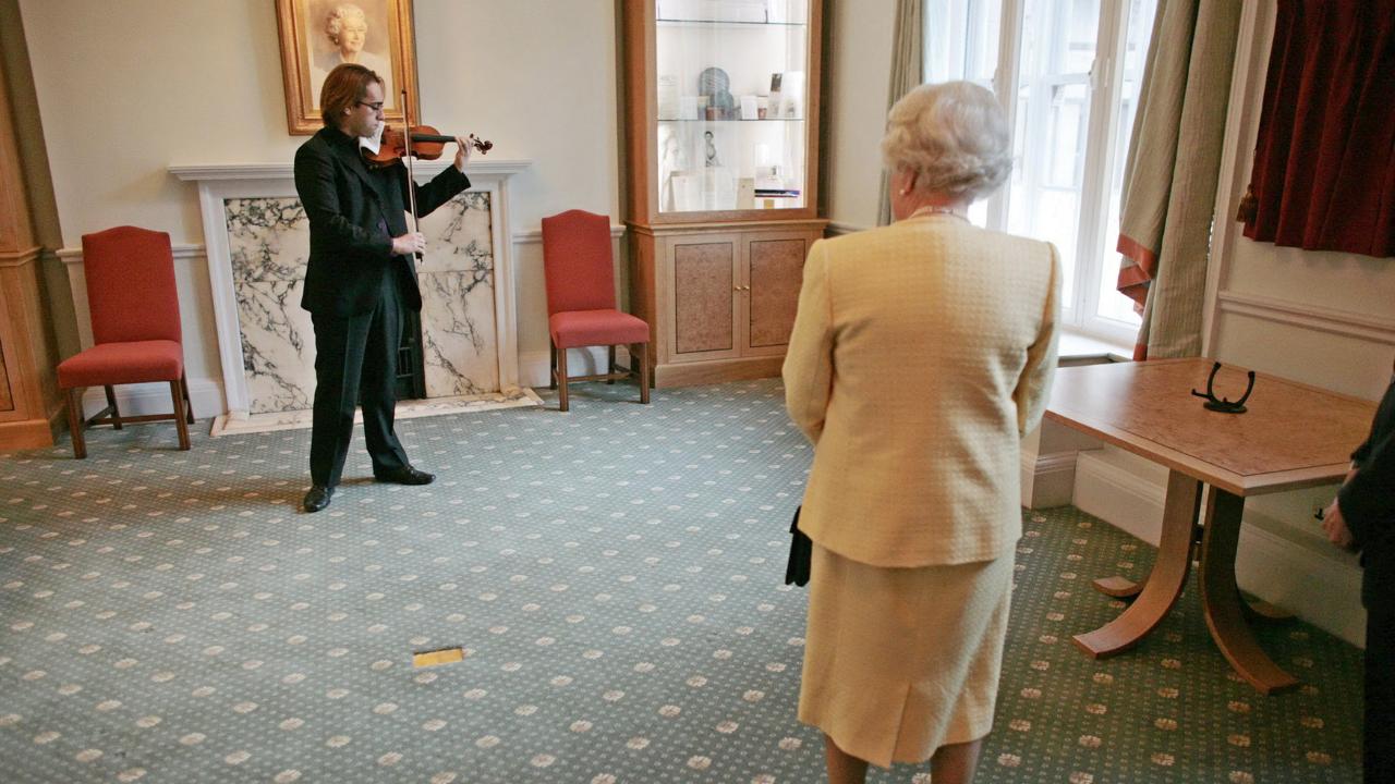 She was also into musicals and appreciated the music of pipe bands. According Discover Music, in a 2016 BBC program, Lady Elizabeth Anson, the Queen’s cousin highlighted that the Queen loved theatre and musicals like Showboat, Oklahoma!, and Annie Get Your Gun. This was one of the first few indications of her musical preferences. Britain's Queen Elizabeth II (R) listens to post-gradute violin student Giovanni Guzzo play a Stradivari Violin, as part of her visit to the Royal Academy of Music in central London, 13 December 2007. (Photo by AFP)