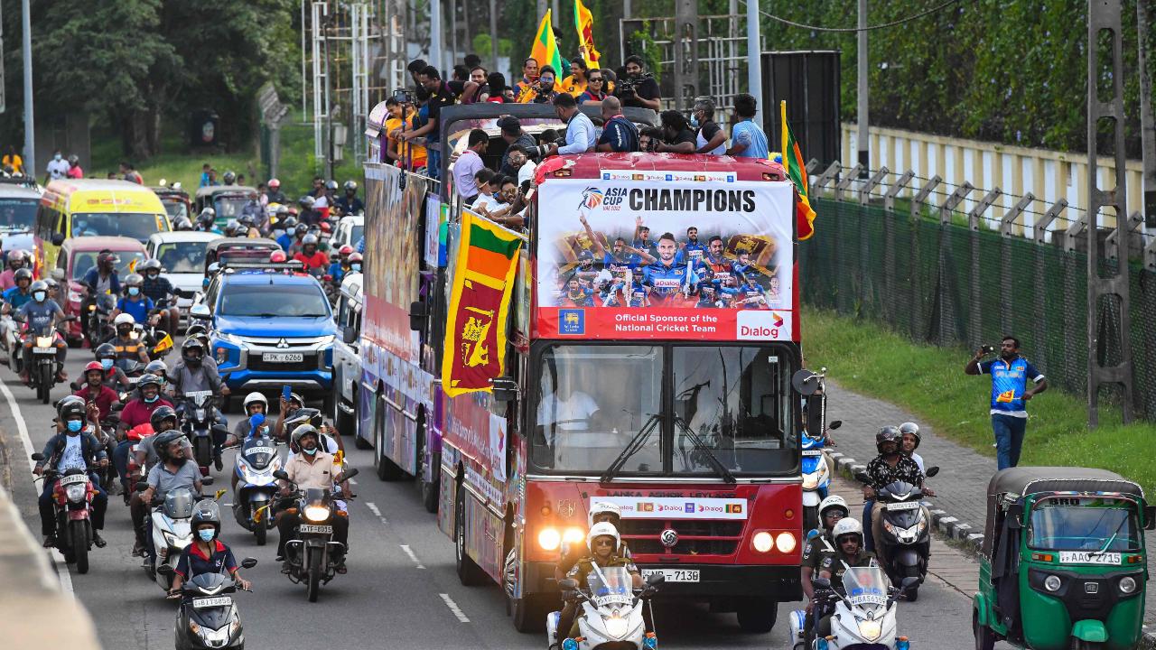 Sri Lankan players celebrating their Asia Cup 2022 success atop a bus back home