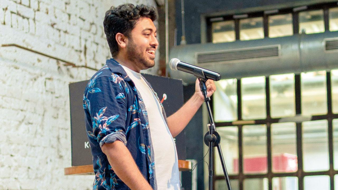 A performer takes the mic at a previous event 
