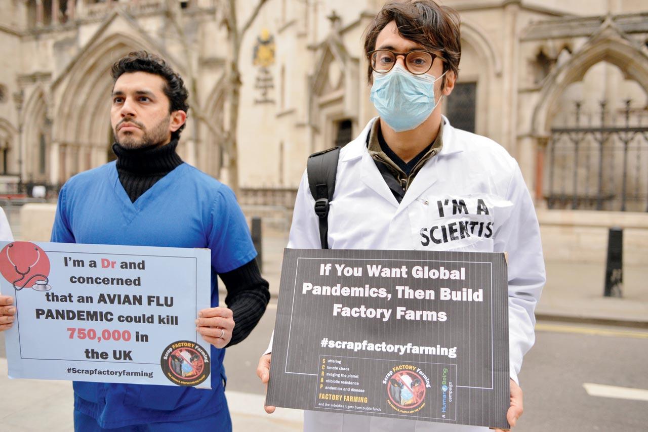 Activists and medical health professionals hold placards warning of the dangers of antibiotic resistance at a protest in London earlier this year. Pic/Getty Images