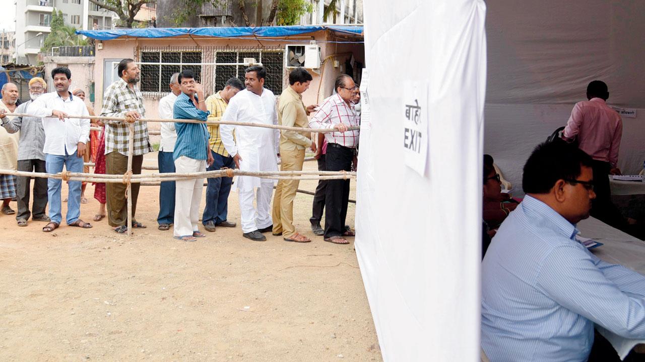 Citizens wait for their turn to cast their votes, during the 2017 BMC polls, at Goregaon. Pic/Nimesh Dave