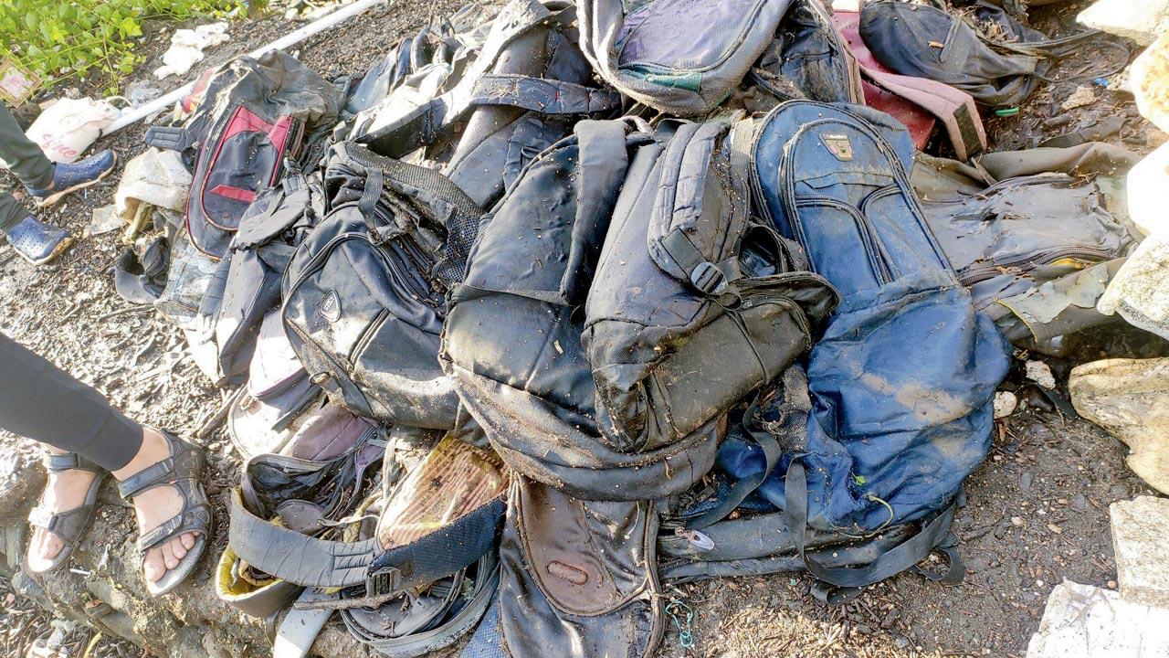 Medical waste, discarded school bags found at a mangrove site