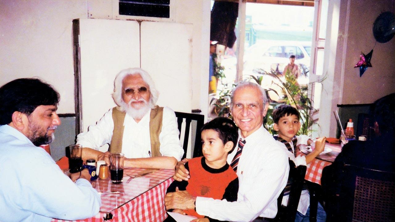MF Husain at Wayside Inn in 1998 flanked by good friends Aziz (Munna) Jhaveri, whose Joy Shoes shop at the Taj was designed by Husain, and café proprietor Pervez Patel with grandson Kaizen. Pic courtesy/Pinky Patel