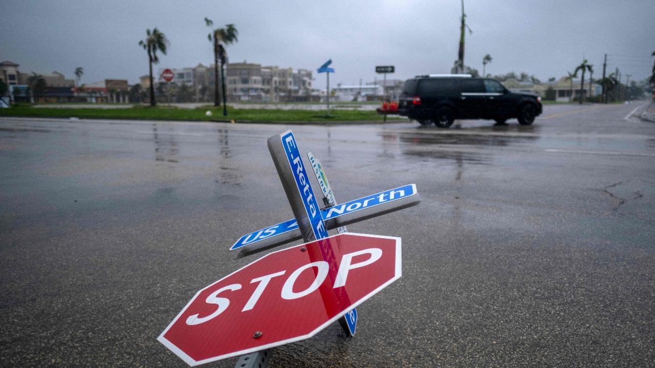 A blown down street sign is seen as the eye of Hurricane Ian passes by in Punta Gorda. Pic/AFP
