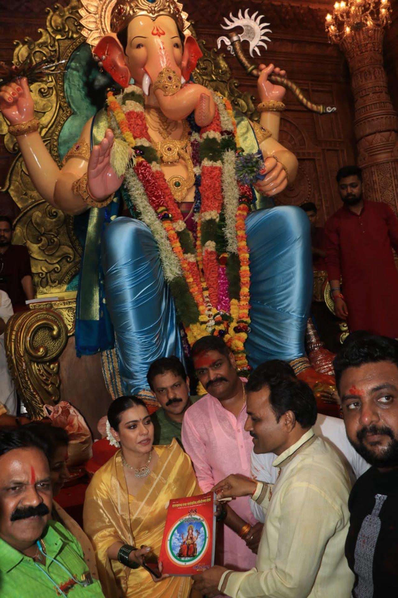 Kajol wore a choker necklace and green bangles to complete her look and can be seen smiling, laughing, and looking surprised as she posed for the camera
Also View: Ganeshotsav 2022: Amit Shah, Eknath Shinde, Devendra Fadnavis offer prayers at Mumbai's Lalbaugcha Raja