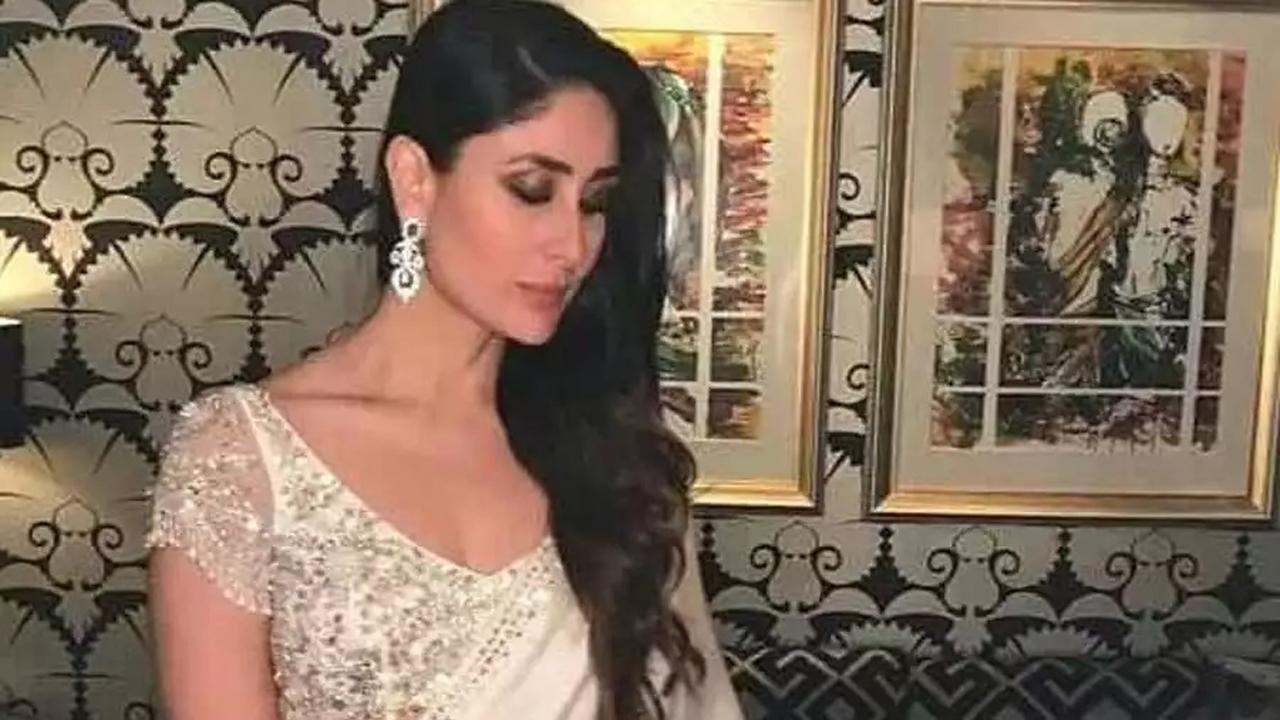 White Love
Kareena's satin snowy saree amped up with a crystal border is one of the dream sarees for every young girl out there. To jazz her look further, she paired the saree with a statement blouse embellished with crystals on the chest and back with net sleeves. She pulled off her classic makeup look with the saree, kohled eyes and nude makeup. As for her jewellery, she kept it all simple and put on just a pair of diamond earrings. Anyways, who needs a necklace when you’ve got those sultry collarbones to flaunt.