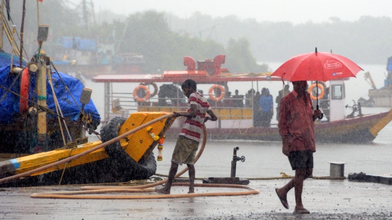 Fishermen were seen in heavy rainfall at Versova bunder, Andheri in Mumbai. Pic/Satej Shinde
