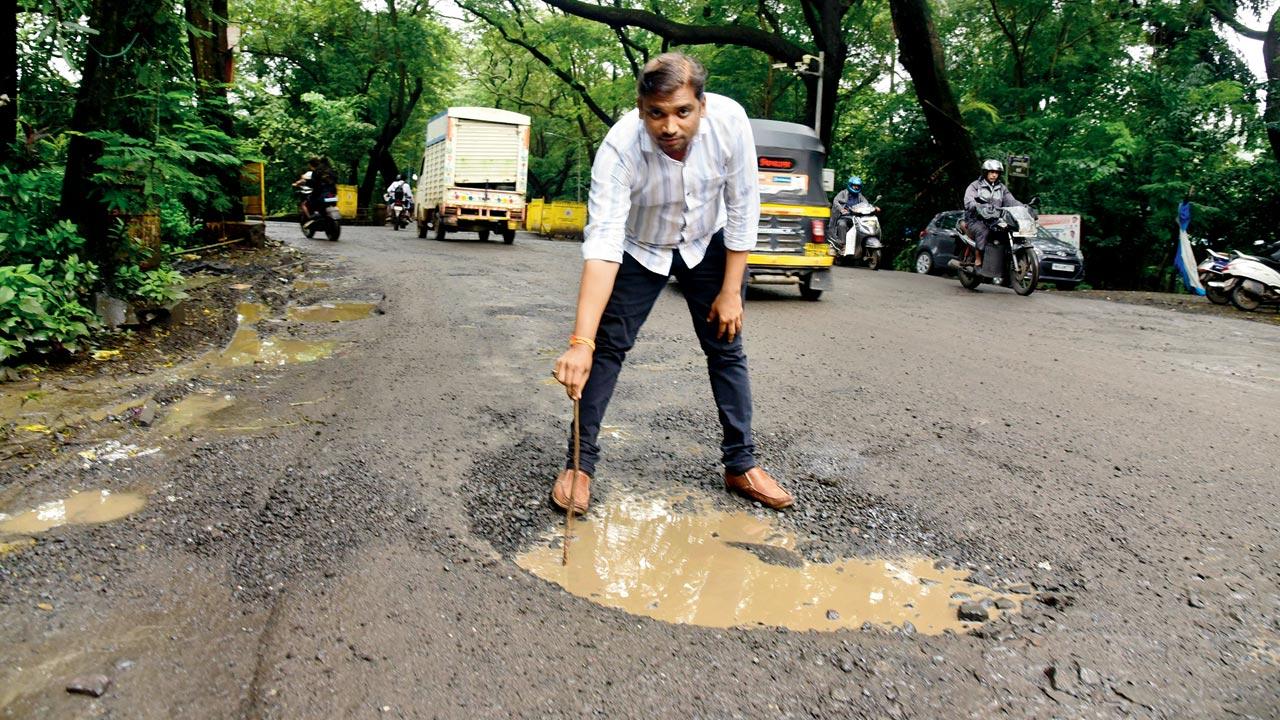 Another huge crater on  the road