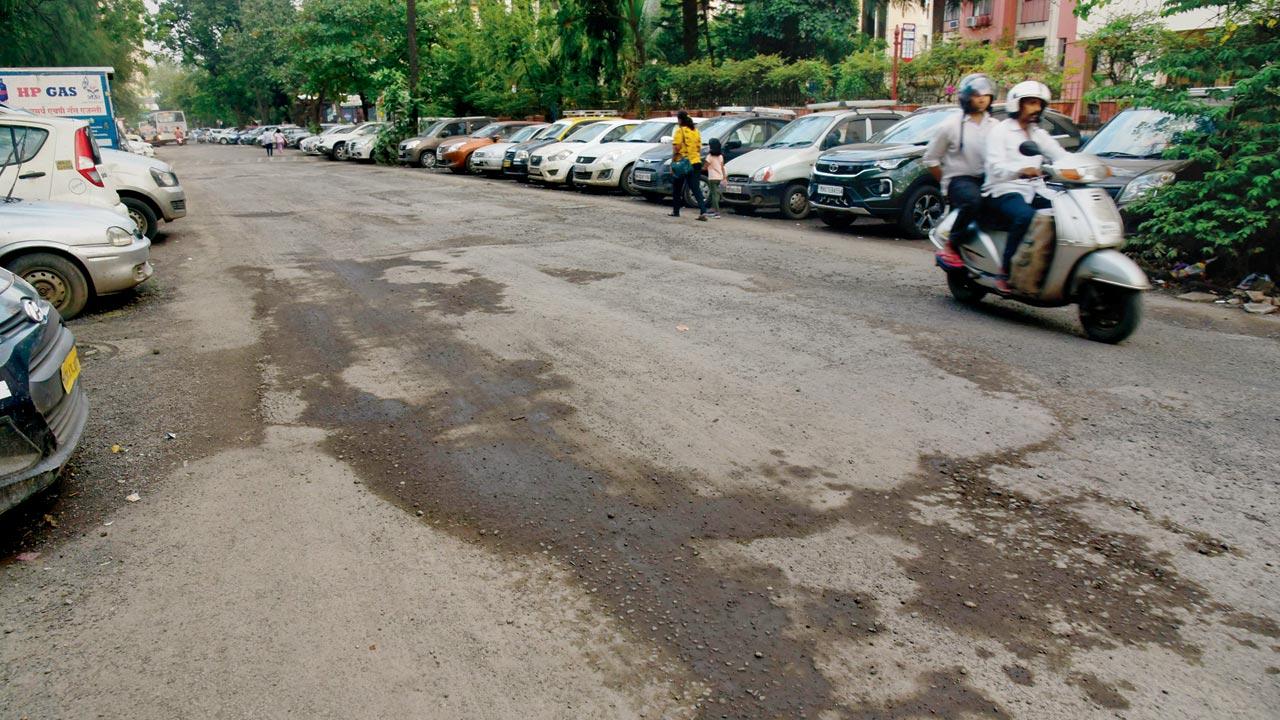 On Friday: Huge potholes cover the road near the bus depot in Pratiksha Nagar last week. Pics/Atul Kamble