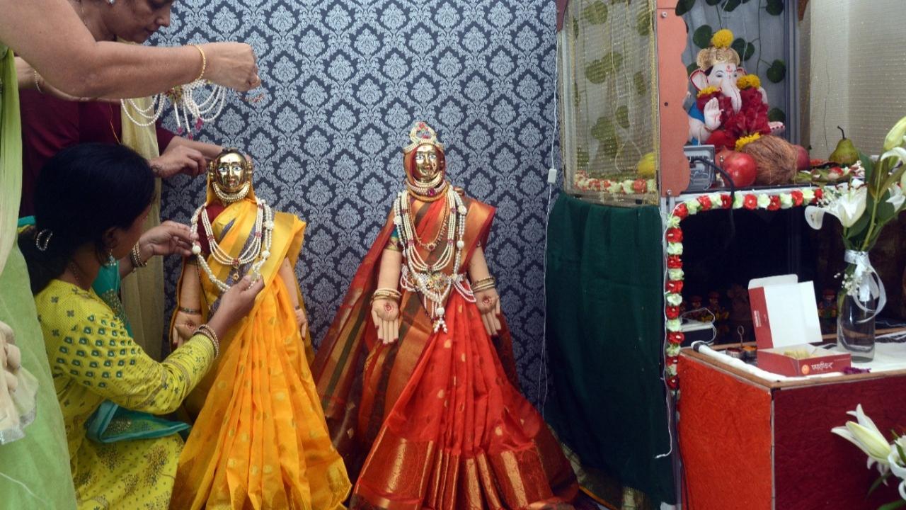 Devotees dress up the goddesses with a traditional sarees, jewllery and other ornaments