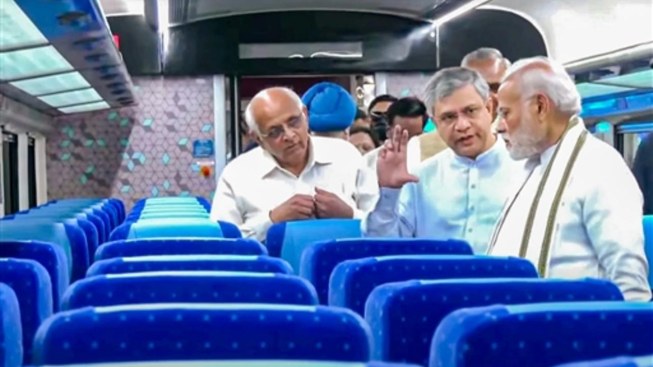 Prime Minister Narendra Modi with Union Minister for Railways Ashwini Vaishnaw, Gujarat Chief Minister Bhupendra Patel and others aboard the Gandhinagar-Mumbai Vande Bharat Express train, in Gandhinagar