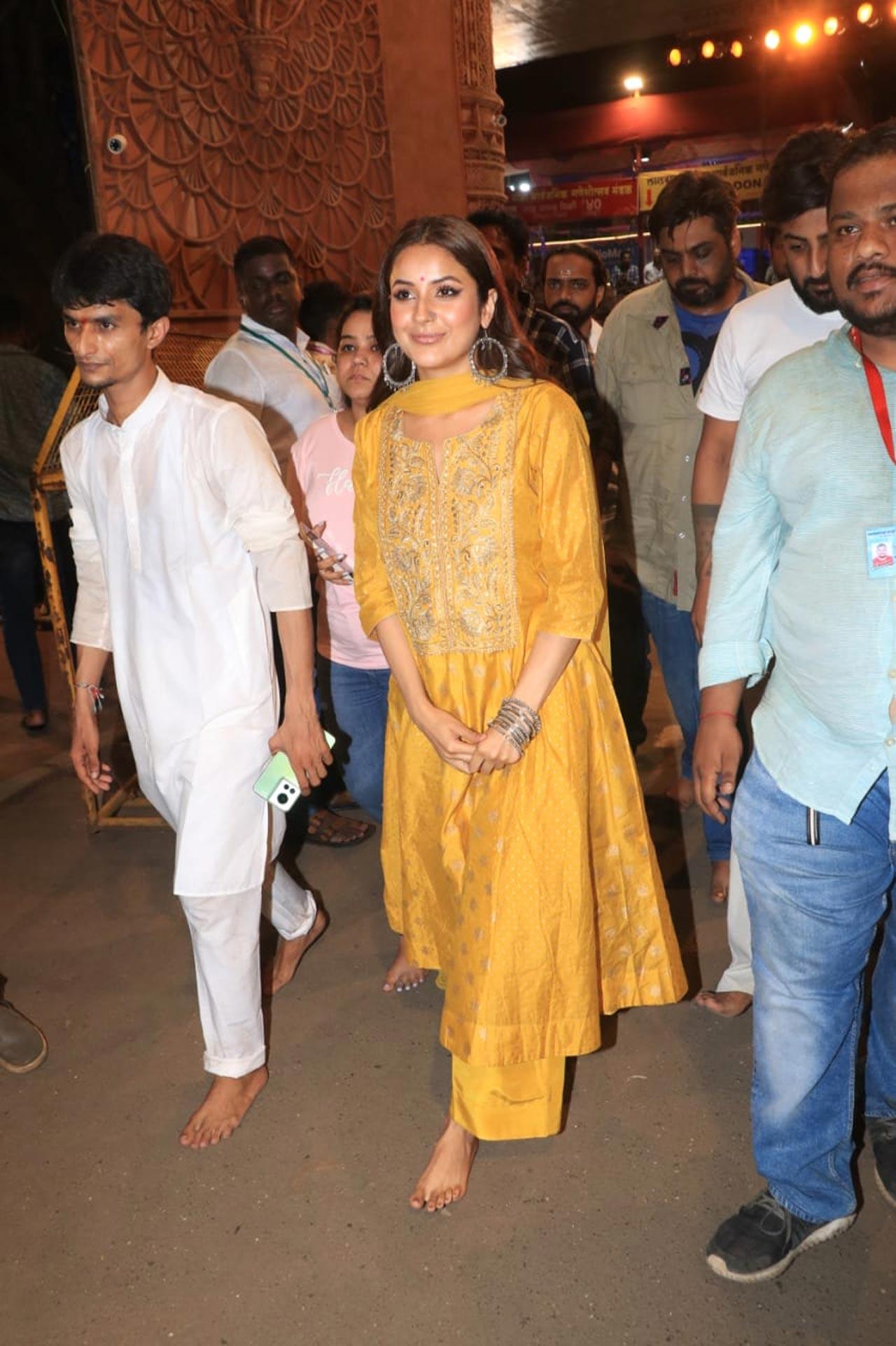 Shehnaaz Gill was clicked with her brother Shehbaz at Lalbaugcha Raja, seeking blessings from Lord Ganesha