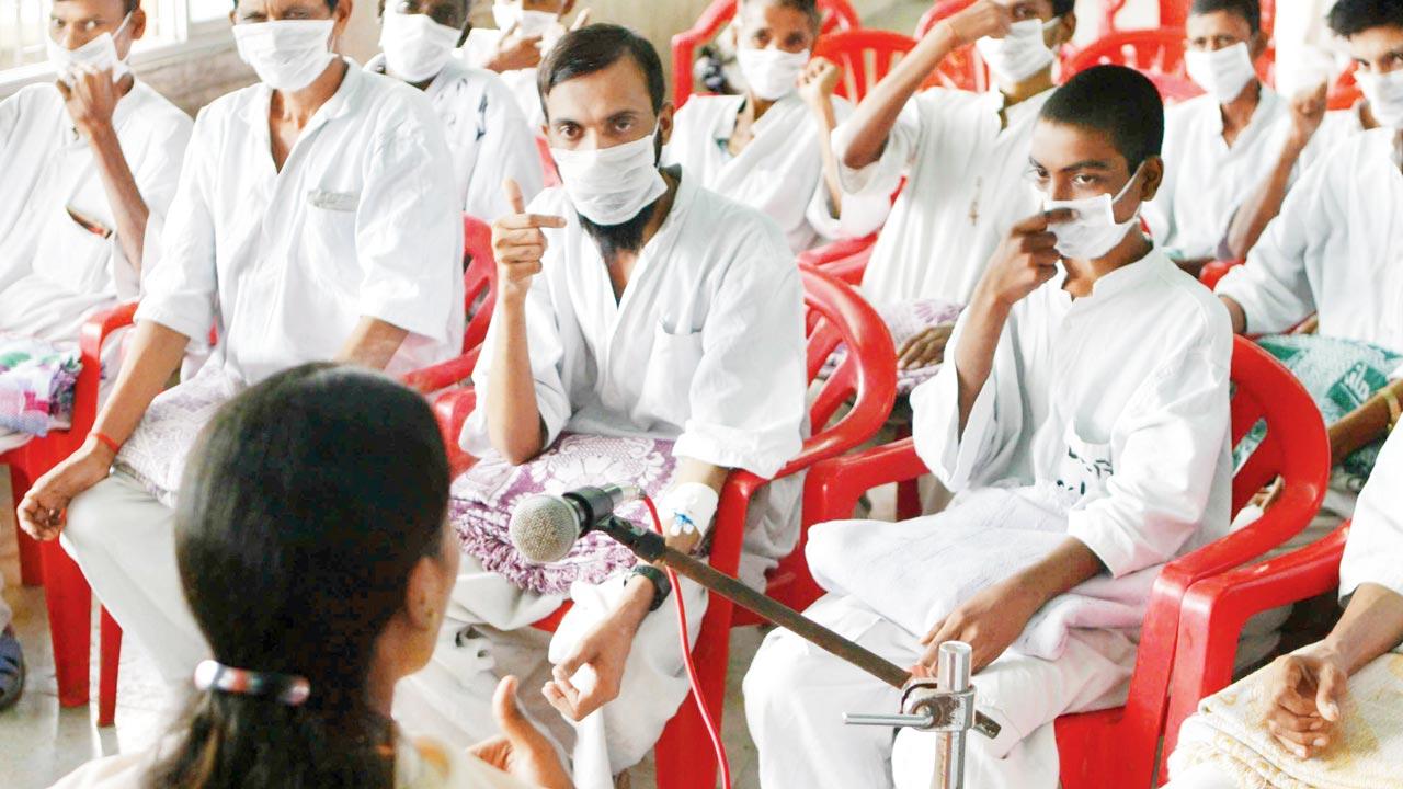 Tuberculosis patients undergo yoga therapy at Sewri Hospital. Pic/Getty Images