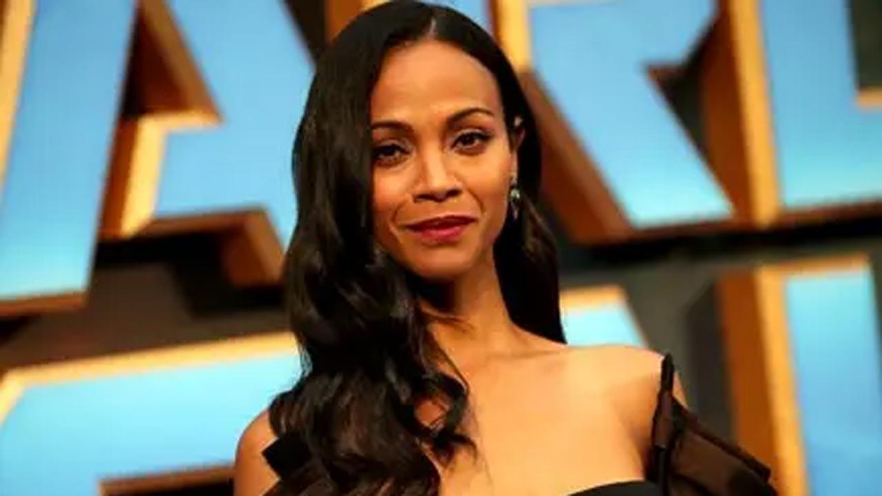 Zoe Saldana shares how having kids helps to keep her 'out of trouble' with aging
