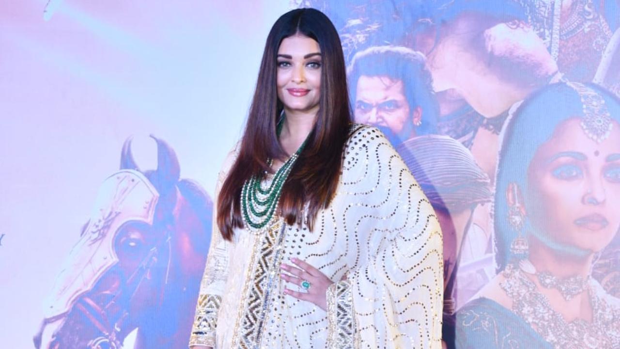 Aishwarya Rai Bachchan opted for an ivory anarkali suit with golden detailing, accessorised with an emerald necklace, which accentuated her beauty.