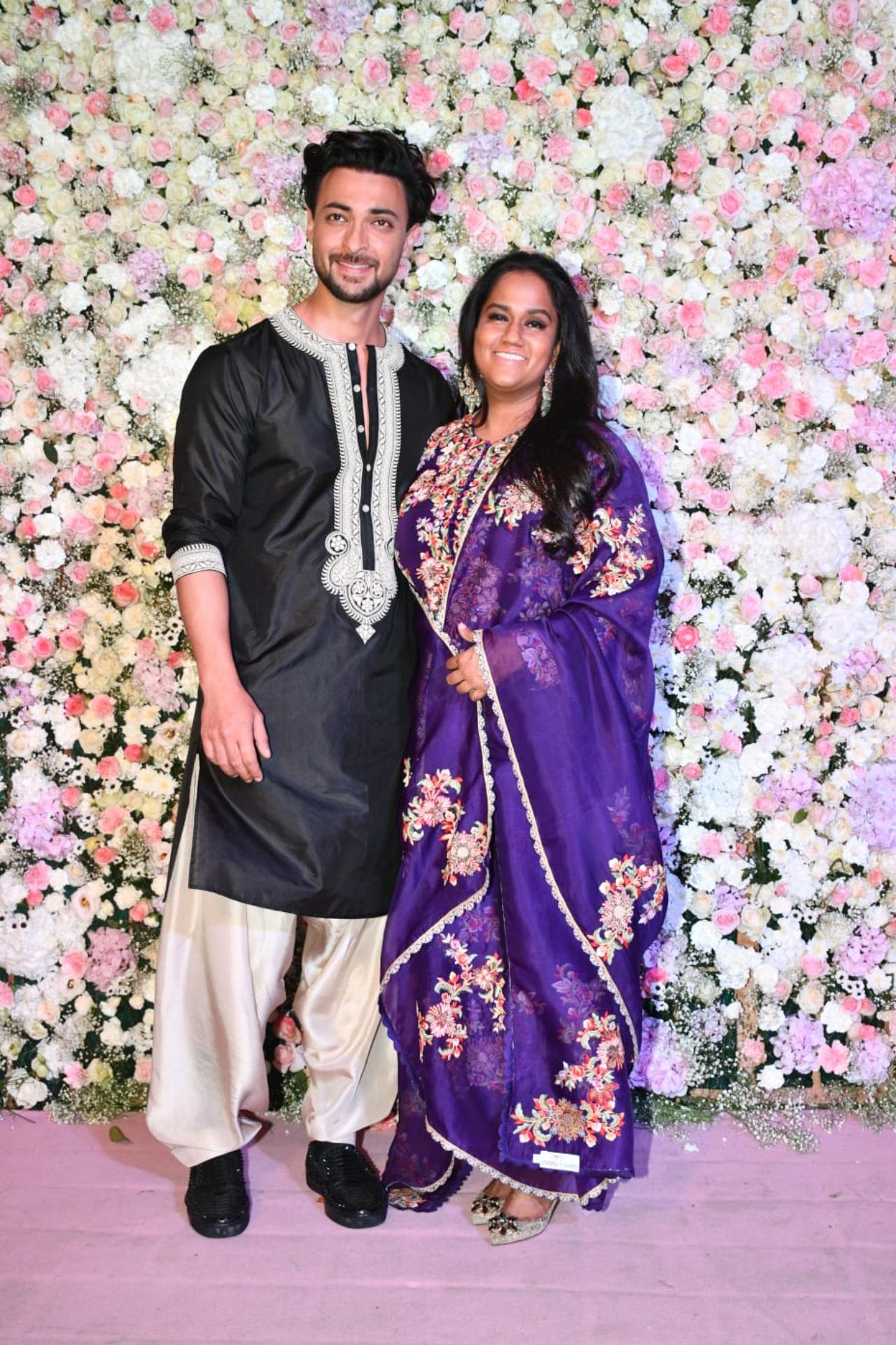 Hosts Aayush Sharma and Arpita Khan were all smiles for the paparazzi as they stepped out in traditional wear to greet the photographers