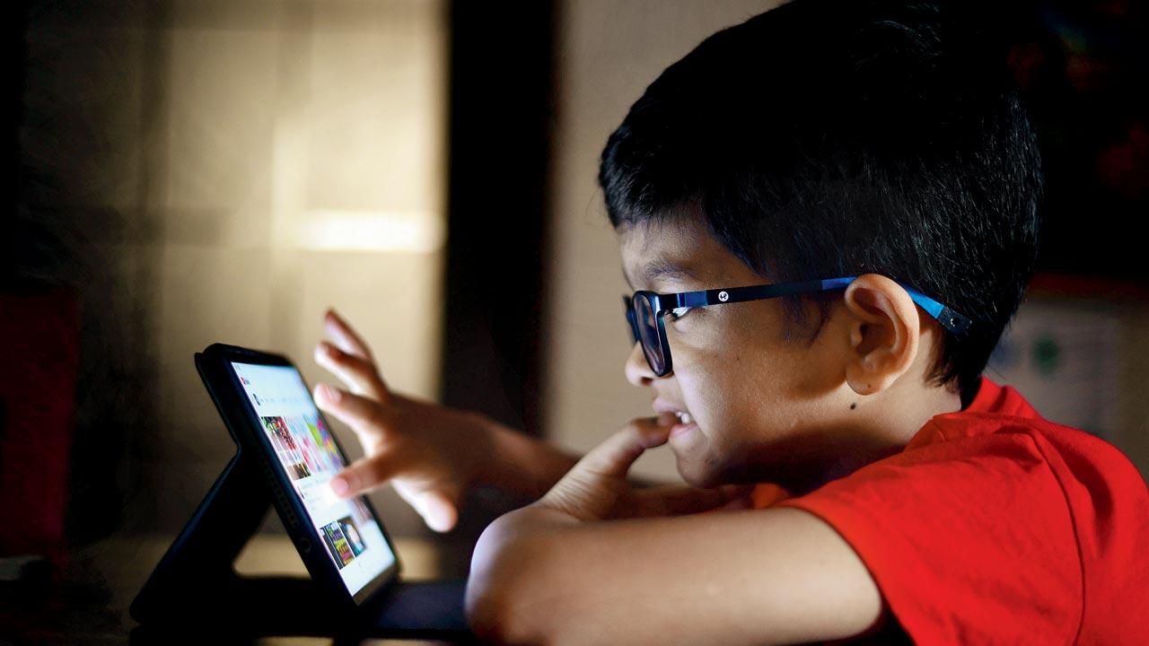 Seven-year-old Arha Surve regularly accesses a host of apps on his tablet for a variety of purposes. Crores of children like him in India could unwittingly end up as targets of violation of privacy, due to the permissions accessed by the apps. These include access to their camera, mic and location. Pic/Nimesh Dave