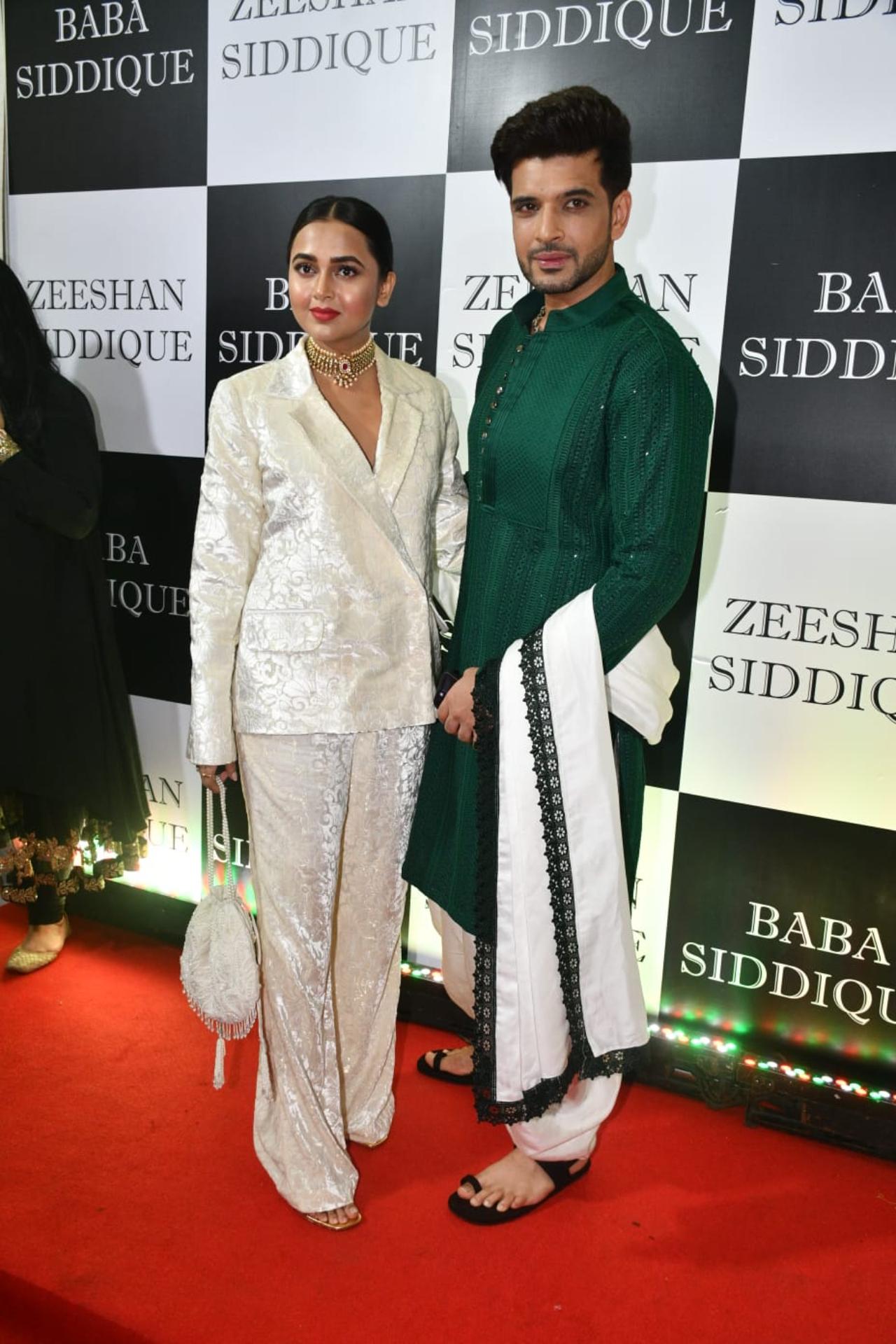 Television's favourite couple Tejasswi Prakash and Karan Kundrra arrived together for the party and posed for the paparazzi. Karan went desi with a green kurta, while Tejasswi opted for a white pant suit for the night