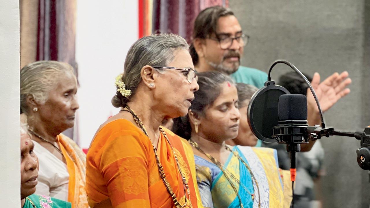 Villagers from Curdi recording compositions that tell their stories at a studio in Goa 