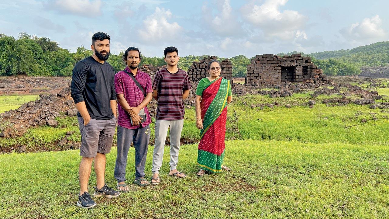 (From left) Naik and his teammates Kalpit Gaonkar and Girish Naik with an elderly villager, Milan Kudrikar 