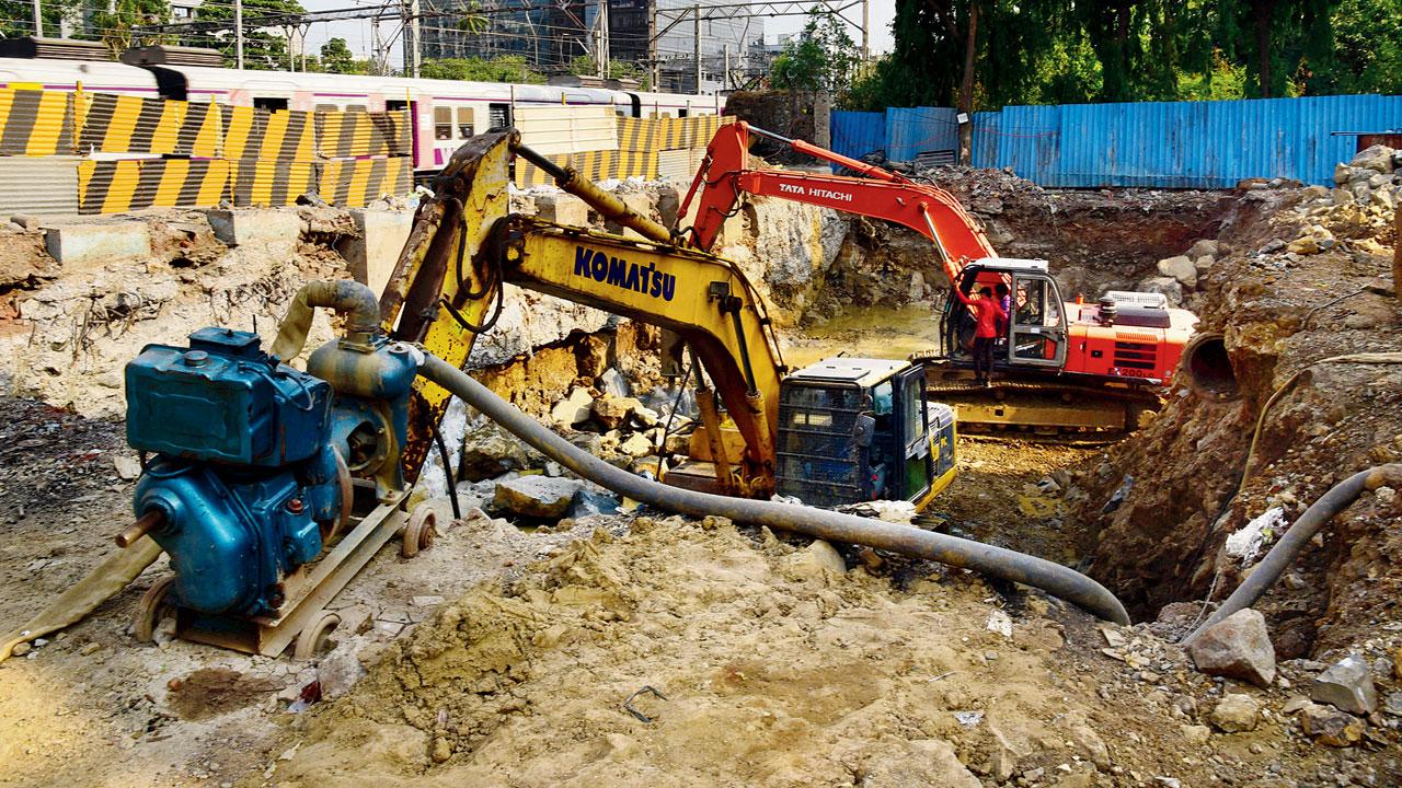 Work being carried out at the site of Gokhale bridge in Andheri, on Wednesday. Pics/Nimesh Dave