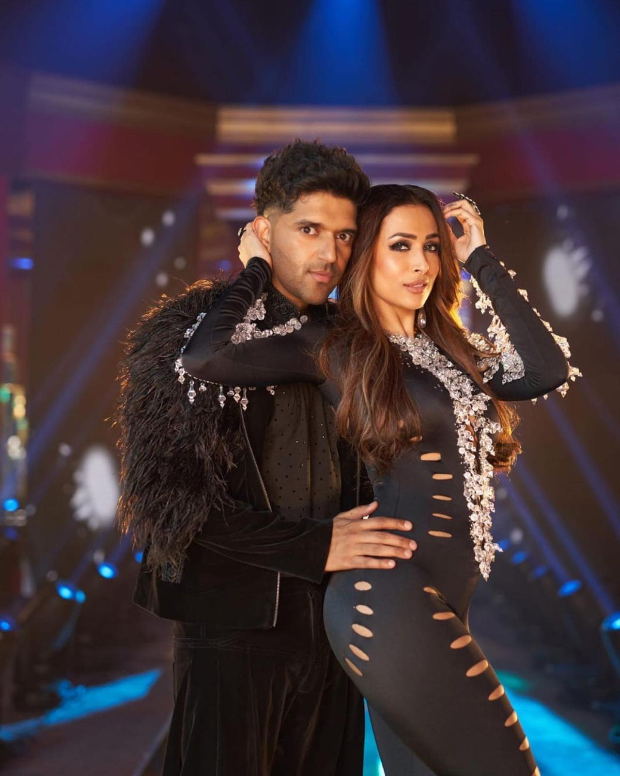 In the three-minute-13-second-long video, the actress-turned-reality show judge is first seen in a black cut-out bodysuit and boots. Then she is seen in a shimmery silver dress and a golden costume as she swans along the neon-lit set In the three-minute-13-second-long video, the actress-turned-reality show judge is first seen in a black cut-out bodysuit and boots. Then she is seen in a shimmery silver dress and a golden costume as she swans along the neon-lit set