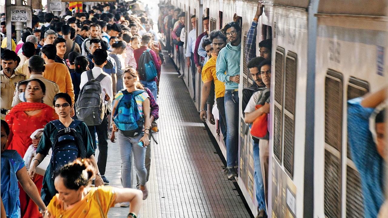 Passengers at Dadar station in March. Commuters allege railways slacking in ticket checking. Pic/Ashish Raje