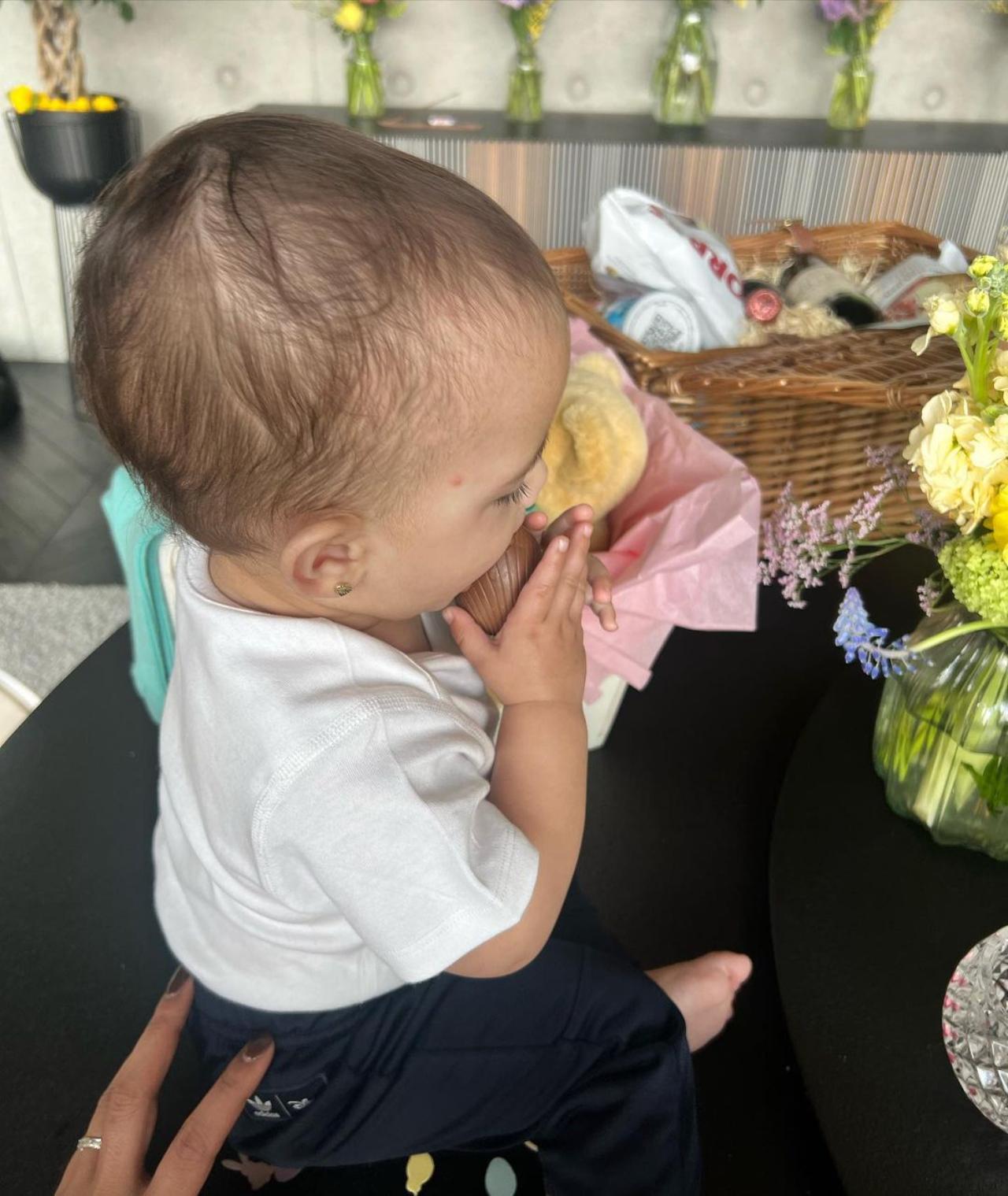In one of the pictures, Malti is seen enjoying the Easter goodies while sitting on a kitchen counter