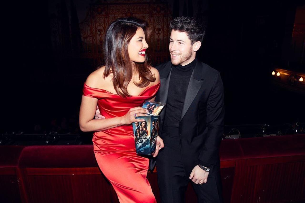 For the premiere night, the 'Fashion' actor opted for a beautiful red off-shoulder deep-neck gown. Nick looked handsome in an all-black suit with sharp lapels and a turtleneck underneath